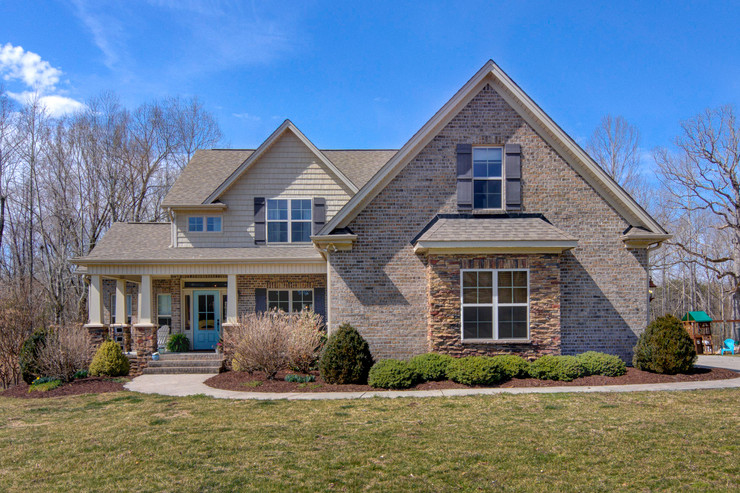 Modern home design with stone facade and brick