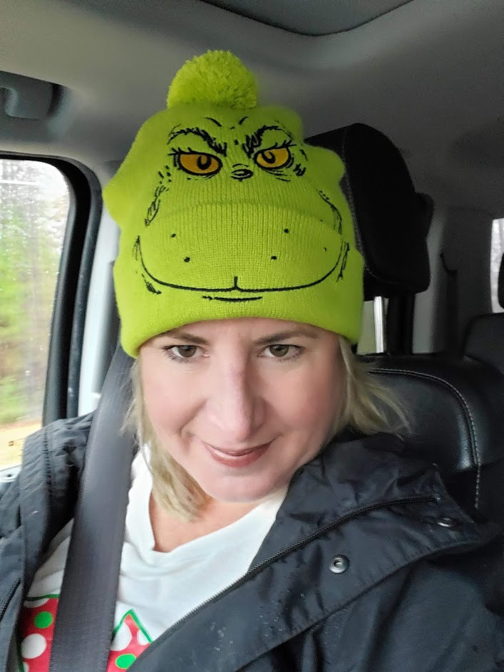 Tori Boysen wearing a Grinch hat