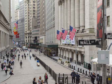 People walking around Wall Street