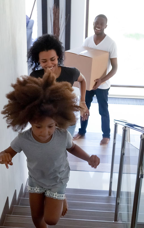 Family excitedly entering their new home