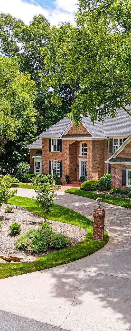 Brick house with curved driveway