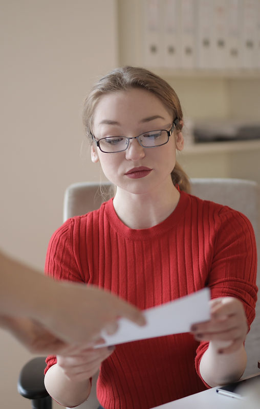 Woman reviewing real estate documents