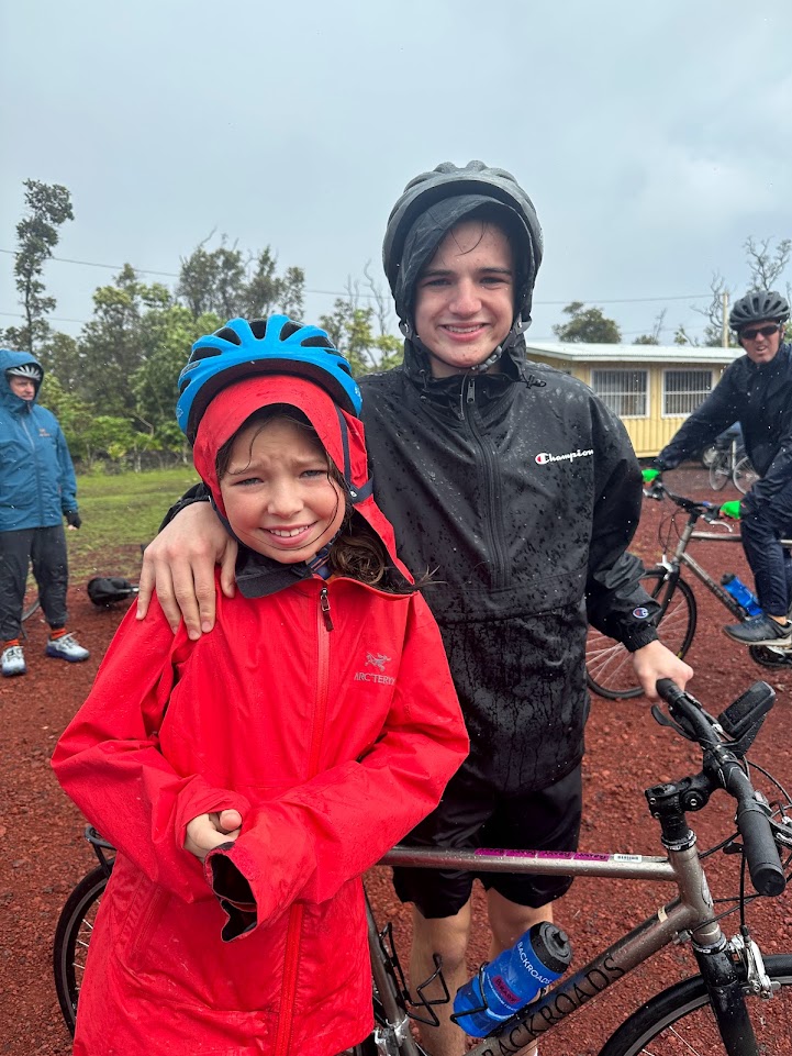 Tori Boysen's children riding bikes in the rain